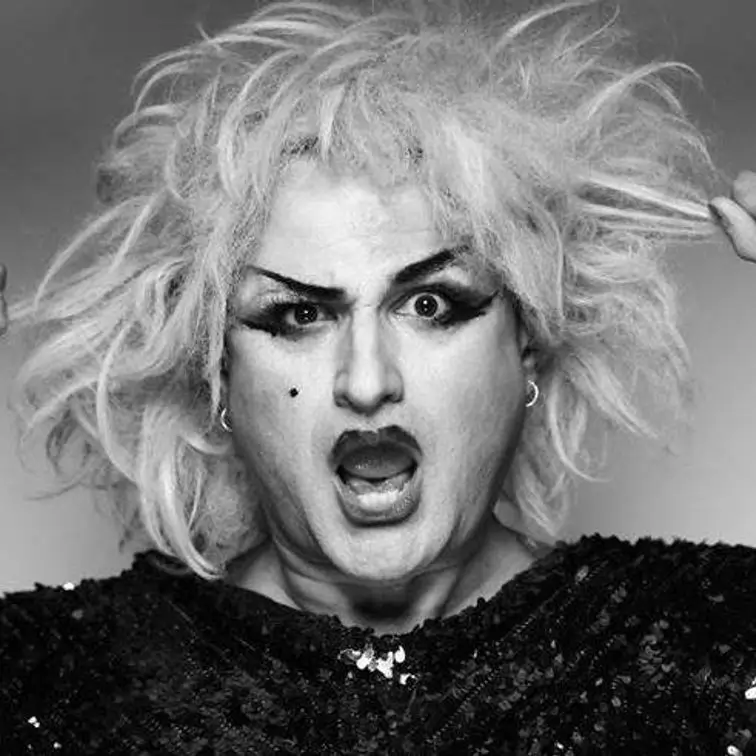 Anita pulling messy blonde hair